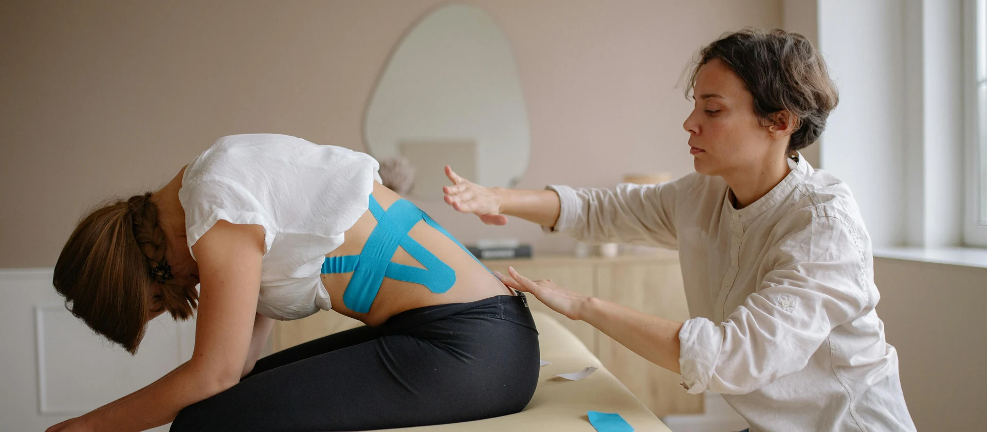 Hands-on massage session used to represent booking and contact at the practice.