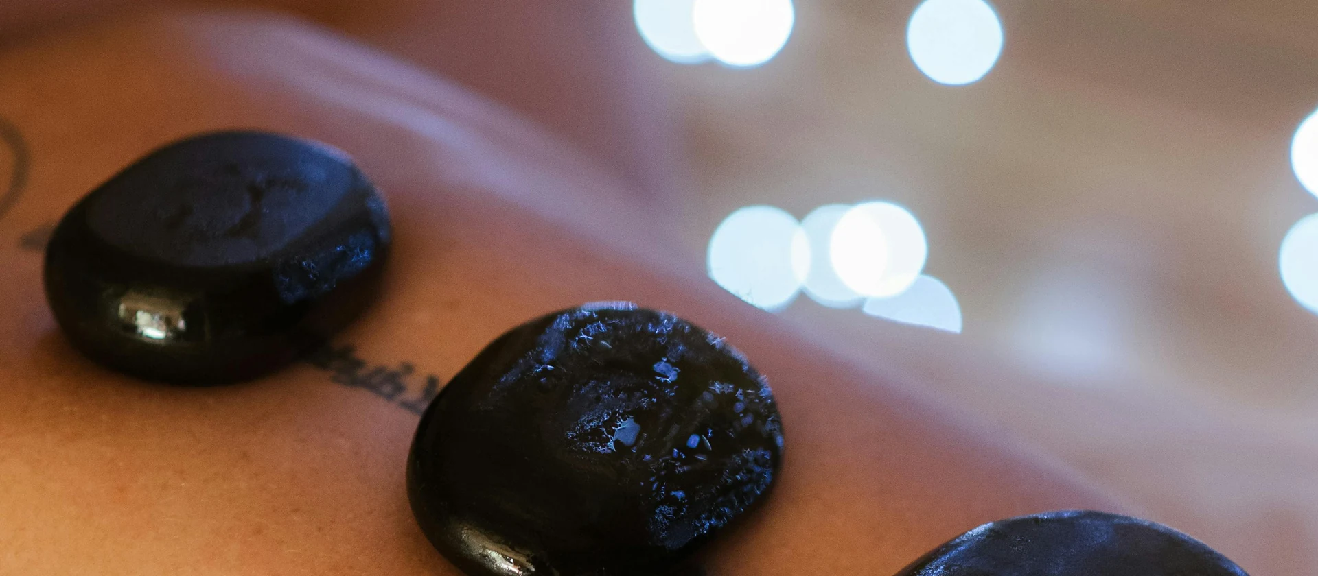 Hot stone treatment used to anchor the site terms page.