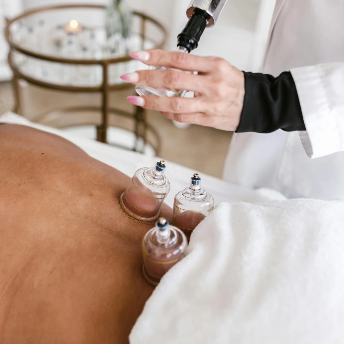 Dry cupping therapy being applied across the back as part of a body-focused treatment.