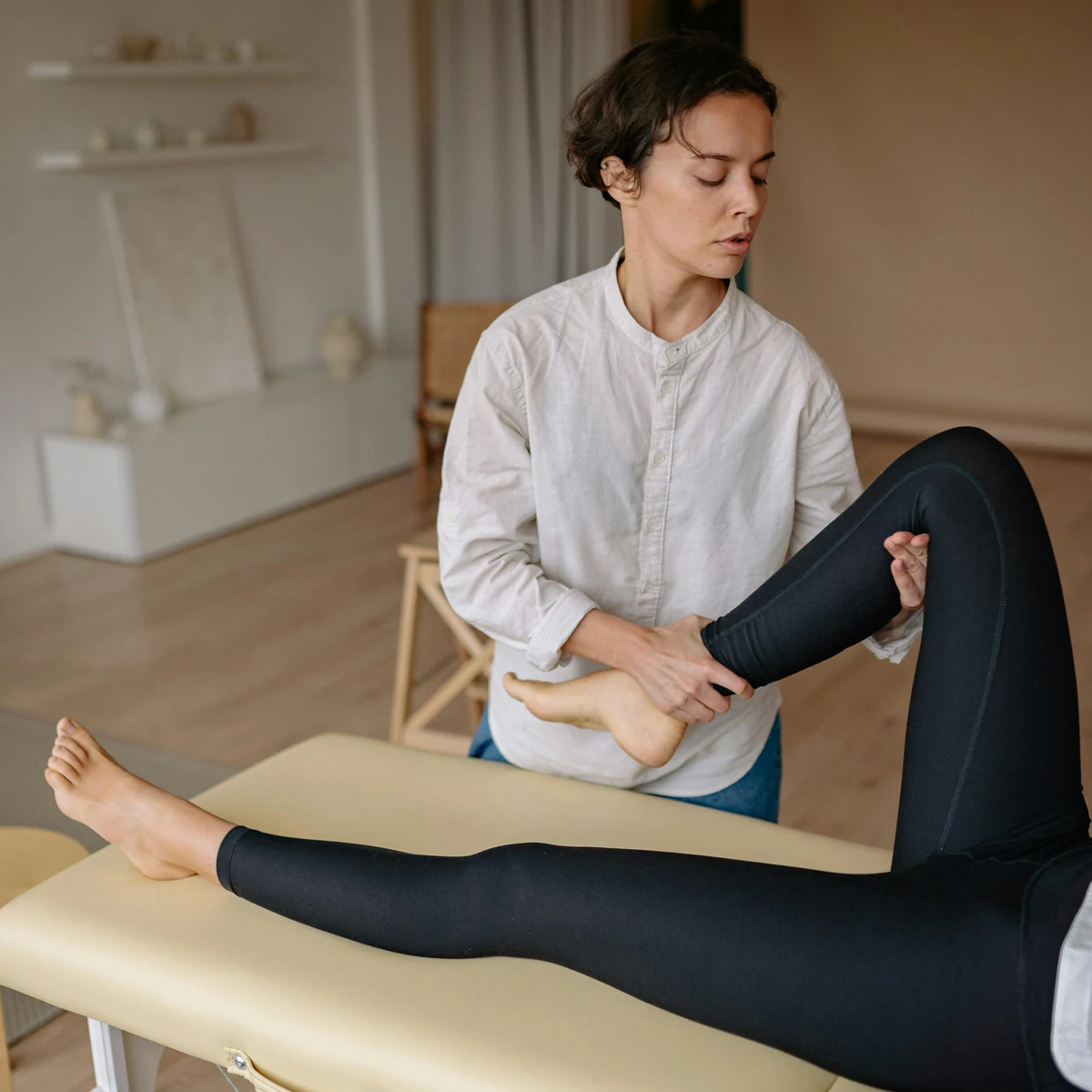 Full body massage treatment in progress with broad, flowing hands-on work.