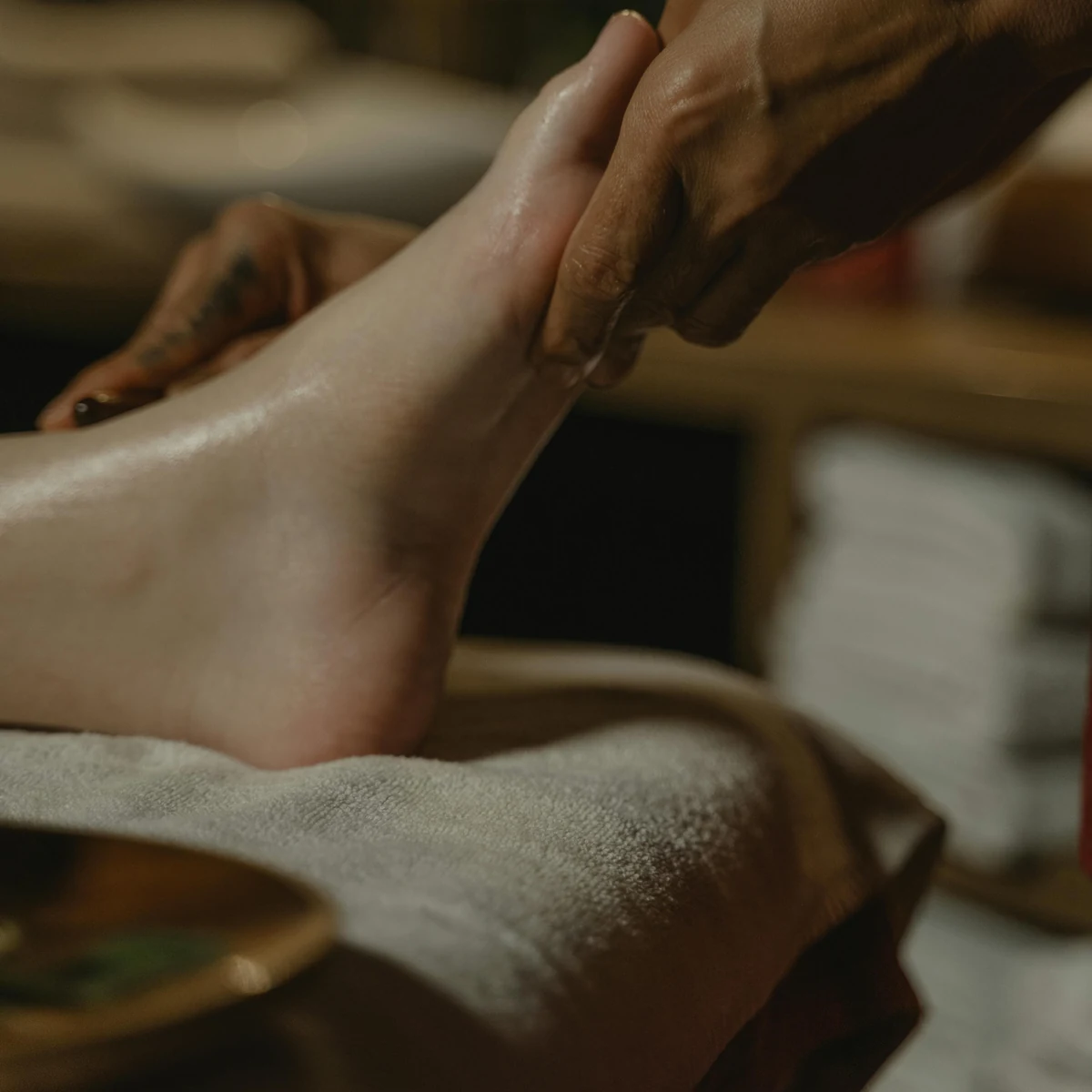 Reflexology treatment on the feet during a slower, restorative appointment.