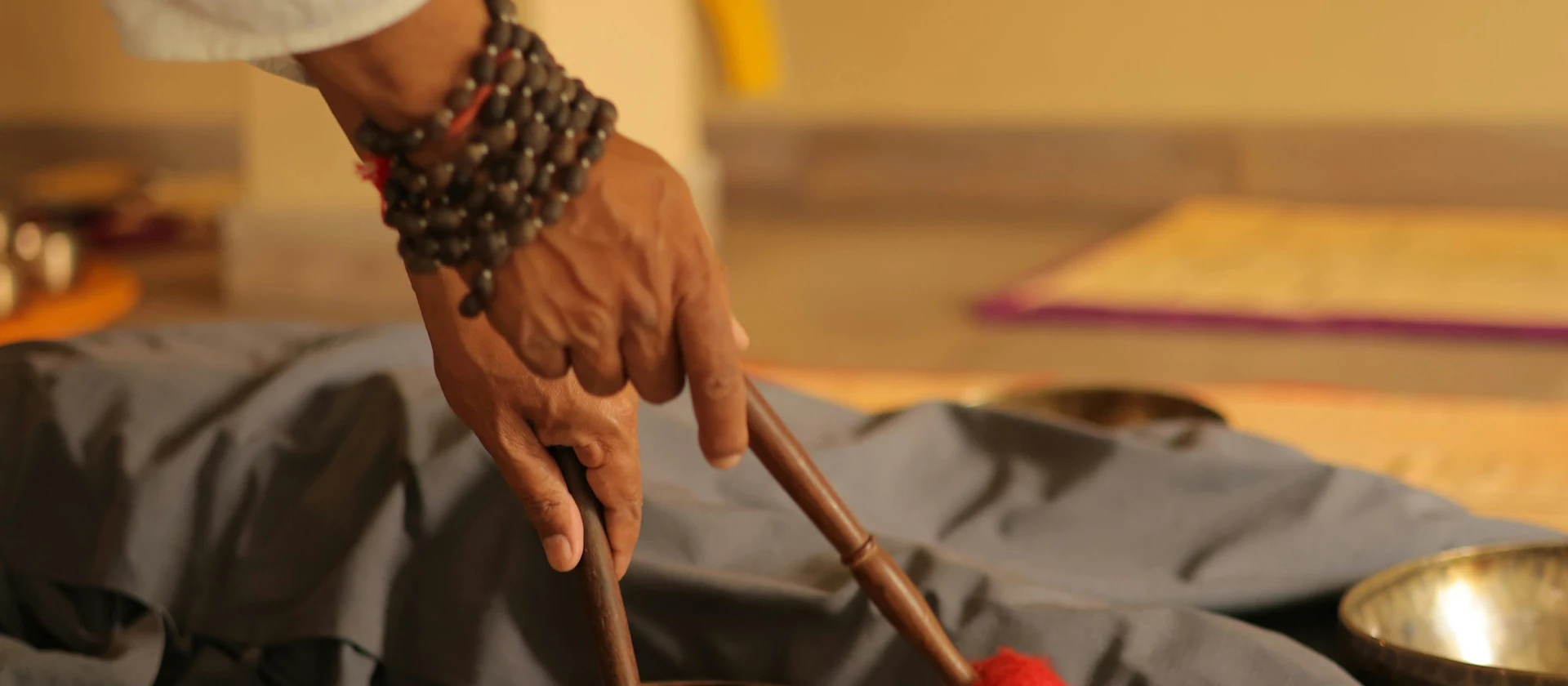 Singing bowls arranged for a sound-based energy healing session in the treatment space.